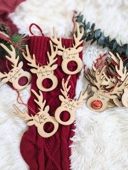 Add a touch of festive charm to your Christmas tree with our personalized Reindeer Chocolate Lindt Holder! This beautifully engraved wooden decoration makes a perfect keepsake for your own tree or a thoughtful gift for a loved one. Ideal for celebrating a baby's first Christmas, it can be customized with one name, making it a unique and personal touch.