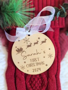 Our personalized engraved wooden baubles make the perfect keepsake for baby&rsquo;s first Christmas. Available in round, star, or heart shapes, each decoration is customized with your baby's name and "First Christmas 2024," complete with a white organza ribbon.