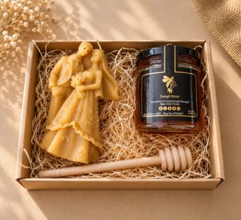 Celebrate the sweet beginning of a couple's journey with our charming wedding gift box, perfect for newlyweds. This delightful package includes:


Wildflower Honey Jar: A jar of our exquisite wildflower honey, harvested from the finest blossoms, adding a touch of nature&rsquo;s sweetness to their home.


Beeswax Candle: A beautifully crafted beeswax candle, designed to create a warm and romantic atmosphere for the couple's special moments together.


This elegant gift box is a thoughtful way to convey your best wishes for a lifetime of love and happiness.