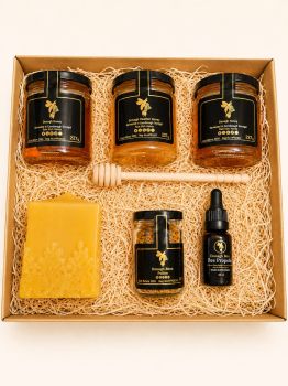 Celebrate the magic of the holiday season with our thoughtfully curated Christmas gift box, perfect for honey enthusiasts and those who appreciate natural wellness. This delightful collection includes:


Two Wildflower Honey Jars: Two jars of our exquisite wildflower honey, each capturing the essence of diverse blooms, perfect for sweetening teas, drizzling over breakfast, or enjoying by the spoonful.


Heather Honey Jar: A jar of luxurious heather honey, known for its rich flavor and aromatic floral notes, ideal for adding a gourmet touch to any meal.


Pollen Jar: A jar of nutrient-rich bee pollen, packed with vitamins and minerals, perfect for boosting energy and health during the busy holiday season.


Propolis Dropper: A convenient dropper filled with bee propolis, known for its immune-boosting properties, making it a thoughtful addition to any wellness routine.


Lace Cube Beeswax Candle: A charming beeswax candle designed in a lace cube shape, adding a warm glow and a touch of elegance to any holiday setting.


Wooden Dipper: A classic wooden honey dipper, perfect for drizzling honey or pollen onto dishes or stirring into warm beverages.


This lovely gift box is an ideal present for family, friends, or anyone who appreciates the sweetness and health benefits of bee products during the festive season.