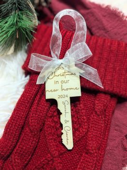 Celebrate your first Christmas in your new home with our personalised Key Shaped Tree Bauble! Made from beautiful 3mm Birchwood plywood, this custom-made ornament features your engraved names, making it a timeless keepsake. Complete with a white organza ribbon, it&rsquo;s the perfect gift for new homeowners.