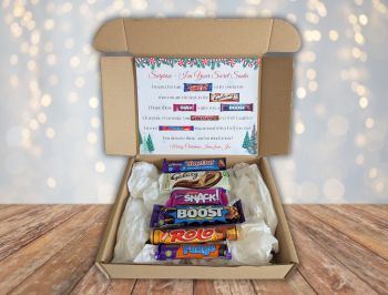 Introducing our Secret Santa Chocolate Poem Gift Box! Packed with six delicious full-sized chocolate bars, it’s the perfect way to spread holiday cheer.