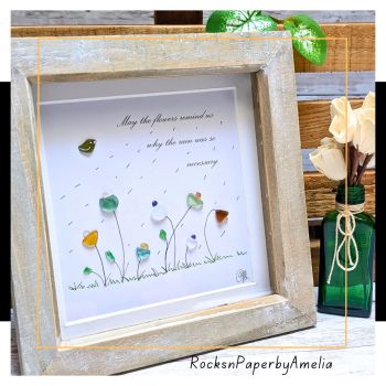 &ldquo;May the flowers reminds us why the rain was so necessary&rdquo; &ndash; a beautiful piece for anyone in need of a pick me up, or simply to display on your wall and admire the beautiful shades of the Irish Sea Glass used for this picture.