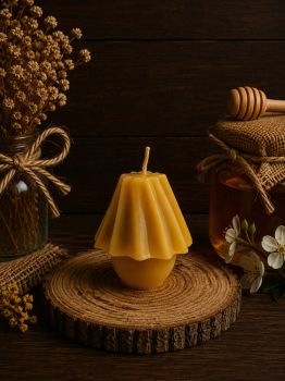 Illuminate your space with the warm, natural glow of our&nbsp;Beeswax Table Lamp Candle. Handcrafted with pure beeswax, this elegant candle not only enhances your decor but also provides a cleaner, healthier burn.

Dimensions: 70mm height x 60mm width
Weight: 77g
Burn Time: Approx. 12 hours

The subtle honey aroma and soft, golden light make it perfect for creating a cozy ambiance. Eco-friendly and toxin-free, it&rsquo;s an excellent choice for any home or as a thoughtful gift. Bring natural elegance into your living space.