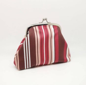 The fabric I used to make this purse is a beautiful soft fabric with a muted stripe in shades of brown, pink and wine. This is a purse made to hold all your essentials. It easily carries coins and notes in the internal coin purse and has two bank card pockets on each side of the external purse. There is also room for a phone and a lipstick. It can also be used as a cosmetic bag. 
