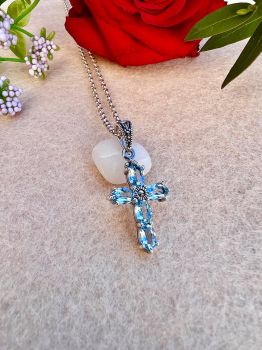 &nbsp;Discover the elegance of our Blue Topaz Silver Marcasite Cross Necklace, blending sophistication and vintage charm. Crafted with genuine gemstones and sterling silver, it&rsquo;s a perfect gift for any occasion. As an Ireland local business, Silver Fountain offers affordable prices and fast delivery. Treat yourself or a loved one to this stunning necklace and experience our quality craftsmanship.