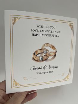 ✨ Elegant Personalised Wedding Card &ndash; 6x6 Linen Finish ✨Celebrate love with a timeless touch. This luxurious 6x6 wedding card is crafted on premium&nbsp;linen-textured cardstock, offering a soft, sophisticated feel.
💍&nbsp;Design Features:


Elegant white or ivory linen base


Personalised with the couple&rsquo;s names in beautiful calligraphy-style font


Optional wedding date beneath the names


Embellished with a delicate&nbsp;gemstone detail&nbsp;


Perfect for:

&nbsp;

Keepsake gifts for the bride &amp; groom


Announcements or reception decor


&nbsp;