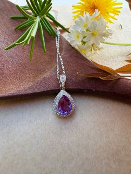 Brilliant pear cut Amethyst with clear Cubic Zirconia set in Silver Necklace
Metal: Sterling Silver&nbsp;
Gem: Brazilian Amethyst
Pendant Size: 21mm x 11mm
Amethyst size: 9mm x 7mm
Chain Length: 40--45cm, adjustable
Birthstone: February