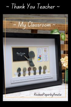 📚✨ Looking for the perfect thank you gift for an amazing teacher? Meet My Classroom &mdash; a personalised pebble art picture that captures the heart of the classroom.This unique piece features a teacher at the blackboard with their name proudly written, surrounded by their pupils at their desks. The classroom wall can be customised with posters to reflect their grade/year or specialised subject &mdash; be it Irish, music, maths, religion, or any other!Whether it&rsquo;s for the end of the school year or as a thoughtful retirement gift, this is a heartfelt way to say &ldquo;thank you&rdquo; for all they do.A lovely idea from the whole class &mdash; a gift they&rsquo;ll treasure forever. 🎁🍎