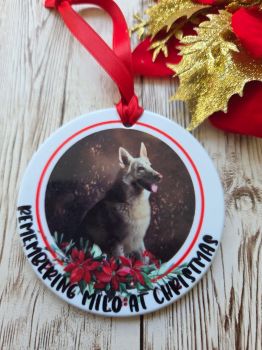 A beautiful festive bauble gift personalised in memory of a treasured pet, printed on acrylic and finished in festive ribbon in a red velvet draw string pouch. A beautiful gift idea for the family and the animal lover. 