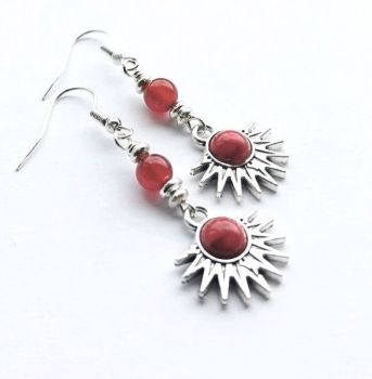 Handmade earrings, created with small antique silver sunburst drops with a deep red marbled centre, silver plated beads, and gorgeous natural red agate stones…. suspended from silver plated, nickel free ear wires (suitable for sensitive ears). The drop on these earrings is approx. 3.8cm/1.5ins. Elevate your look with these beautiful bespoke earrings… They arrive in a pretty organza bag… and with free shipping!
Carnelian is known for its vibrant, action-oriented energy, believed to boost courage, motivation and passion... It's associated with emotional well-being, helping to break through emotional blockages and anxiety.