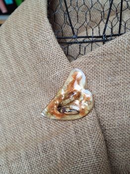 Handmade brooch with real dried flowers and golden shimmer – part of the Honey Glow, Amber Shadow series.