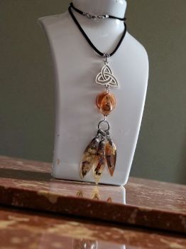 Symbolic Celtic necklace with cascading resin drops and real flowers. Price per pendant.