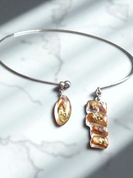Contemporary choker with two resin pendants filled with dried flowers. Handmade. Adjustable fit.