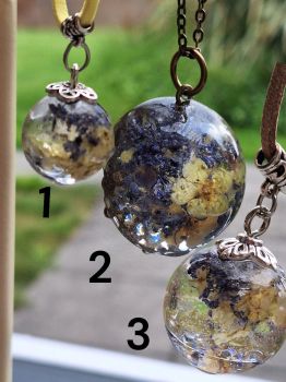 Three botanical resin pendants with real flowers — faux suede cords or bronze chain. Price per piece. Choose your style.