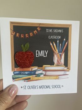 Especially Designed for TeachersMake your students’ first day unforgettable with a custom welcome card created just for classrooms. Each card features the student’s name, teachers name, school name, and school year, with sparkling glitter and gem details for an extra-special touch. Perfect for welcoming each child individually and framing with a first-day photo—creating a keepsake families will treasure for years. Minimum Order of 5.