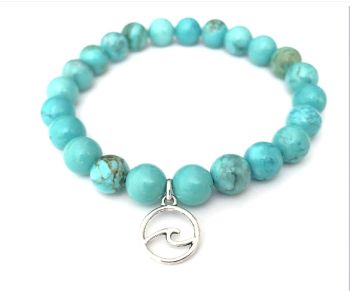 Introducing Harmony… a beautiful turquoise bracelet (stretch) with silver plated wave charm… a gorgeous bracelet, perfect for summer/Holidays.... Enhance your style with this beautiful bespoke piece! It arrives in a pretty organza bag… and has free shipping!
Turquoise is often considered a protective stone, believed to ward off evil, deflect negative energy, and shield the wearer from electromagnetic pollution.It is also seen as a stone of purification, cleansing the body and environment of negativity.