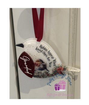 Beautifull Acrylic memorial robin with glitter red breast.
Measures 10cm, supplied with a red satin ribbon and gift box.
A name can be added to the red breast.