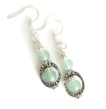Beautiful handmade earrings, created with antique silver frames, silver plated beads and gorgeous natural aventurine gemstones. They are suspended from silver plated, nickel free ear wires These earrings are light and comfortable to wear… showcase your indivuality with these bespoke beauties! They arrive in a pretty organza bag, and, have free shipping! Aventurine, a type of quartz, is believed to offer a range of healing and positive effects, both physically and emotionally. It is often associated with luck, prosperity, and emotional balance. It is thought to calm anxiety, promote creativity and encourage compassion.