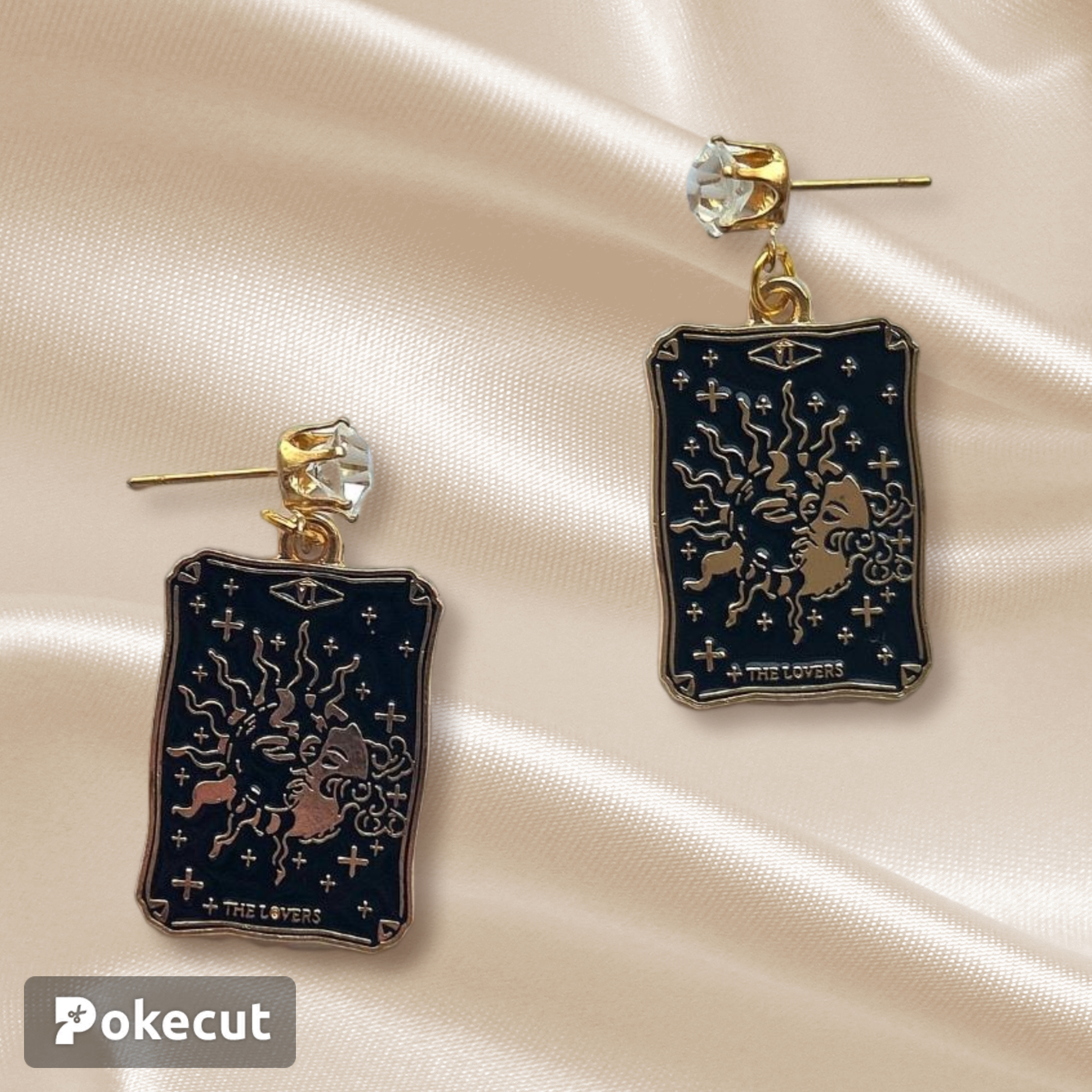 Cute tarot cards enamelled charms. The card is The Lovers and the image depicts a sun and moon. Lovely design in black and gold