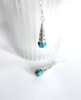 Gorgeous antique silver drop earrings with deep turquoise pumpkins (natural howlite gemstone - dyed)… They are suspended below silver plated, nickel free ear wires… suitable for sensitive ears. Light and easy to wear. Elevate your look with these beautiful bespoke pieces! They arrive in a pretty organza bag, and, have free shipping!