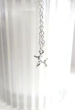 A cute antique silver (polished) balloon dog pendant, suspended from a silver plated chain, clasp and extension chain… the chain is approx.40cm /16ins, plus extension approx. 5cm/2ins. The dog charm is approx. 1.3cm/0.5in in length. This gorgeous, dainty little pendant is lightweight and easy to wear… great for gifting! Arrives in a cute little velvet pouch… and has free shipping!