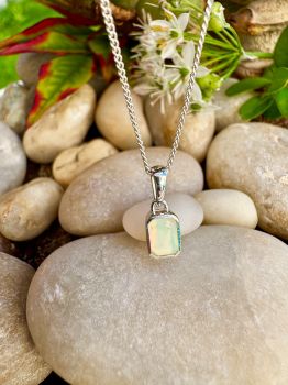 Brilliant emerald cut Opal bezel set in Silver Necklace
Metal: Sterling Silver
Gem: Genuine Ethiopian Opal
Stone Size: 6mm x 4mm
Birthstone: October
