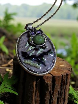 A magical two-layer pendant with real dried thuja and embroidery, topped with a charming owl figure.