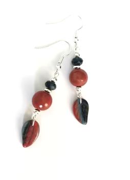 Handmade autumnal earrings, created with beautiful czech glass leaf drops, in a deep russet colour, accented by navy, acrylic beads also in a russet colour, silver plated beads and natural jade beads (dyed) in navy. The ear wires are silver plated and nickel free, suitable for sensitive ears... Elevate your autumn look with these bespoke pieces!&nbsp; They arrive in a pretty organza bag, and, have free shipping!