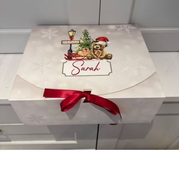 Personalised Giftbox - Candy Cane Lane
Fillable treat box perfect perfect for poppong in Christmas gifts.
High quality print with luxury double faced red satin ribbon.
Box measures 31x25x12cm. Personalised with a name in red vinyl.