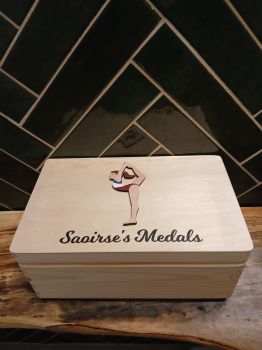 Personalised Gymnastics Medal box, with option to put club crests on box.&nbsp; Choose hair colour, skin tone and kit colour. Box is finished with a non toxic wax.
The dimensions of the box are 29cm x 18cm x 13cm a very generous size to store all your well earned medals.
The ideal gift for any gymnastic fanatics with a medal haul and nowhere to store them. Leave them speechless with this personalised medal box, something they will have to cherish their medals . This personalised gymnastics medal box is the perfect gift for a birthday, mothers day, fathers day, communion, confirmation or Christmas present. A truly unique gift.