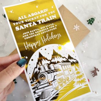 Step into the magic of Christmas with this&nbsp;Golden Ticket for the Santa Train. Featuring a luxury gold foil finish and a festive train illustration, this keepsake card makes the perfect holiday surprise.
Each ticket is crafted on premium 300gsm cardstock, paired with an eco-friendly kraft envelope, and comes ready to gift. With a non-personalised design, it&rsquo;s available straight away &ndash; no waiting, just festive joy. Handmade in Ireland, this ticket is an unforgettable Christmas keepsake for both children and adults.
&nbsp;
✔ Premium 300gsm cardstock with shimmering gold foil✔ Includes eco-friendly kraft envelope✔ Non-personalised design &ndash; ready to gift✔ Blank inside for your message✔ Handmade in County Cork, Ireland
