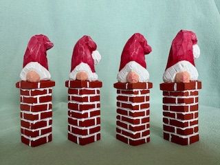 Santa carving, santa stuck in chimney. Completely handcarved from one piece of basswood using only handtools (whittling knife, gouges). Handpained with acrylic paint. Individual variations in wood, shape and texture will occur. 10x2.5cm. 