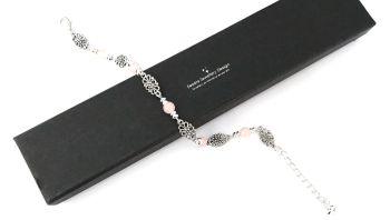 A gorgeous, dainty bracelet, created with antique silver filigree beads, silver plated beads and beautiful, opaque glass beads in a very light coral colour.. the bracelet is approx. 19.68cm/7.75ins in length, plus an extension chain approx. 5cm/2ins in length (with tiny silver plated heart charm). A lovely lightweight bracelet, suitable for a variety of occasions. Elevate your look with this pretty bespoke piece! It arrives in a pretty organza bag, and has free shipping!