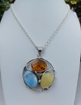 A combination of natural stone colours in this Amber and Larimar pendant. Lapis Jewellers in Dublin specializes in natural stone set jewellery in gold and Silver.
