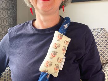 These are chemotherapy port support pillows made using soft cotton fabric. Each pillow is filled to medium firmness for comfort. There is a large flap with two sets of velcro fastenings. The velcro will enable to the pillow to be attached to a chosen area.&nbsp;&nbsp;
I've used this Pugs with red collars fabric for these pillows, with a handmade with love by Rodgersonhandcraft label.
This support pillow is ideal for use directly after chemotherapy, or if the area feels tender.&nbsp;