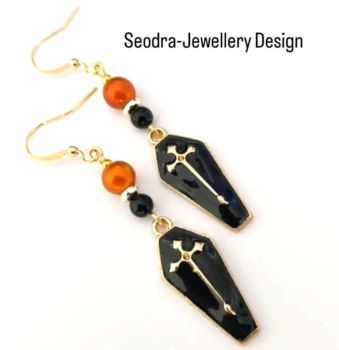 Handmade Halloween earrings, created with gold plated coffins, beautifully enamelled in black, iridescent glass beads in orange and black acrylic beads. The ear wires are gold plated and nickel free, suitable for sensitive ears. Add some spooky fun to your look this Halloween with these beauties! They arrive in a pretty organza bag, and have free shipping!