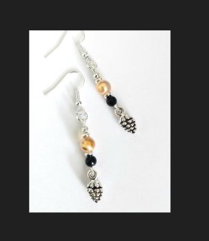 Handmade earrings, created with cute antique silver pine cones, silver plated beads, small black acrylic beads and gorgeous irididescent glass beads in a light apricot colour. They are suspended from silver plated, nickel free ear wires, suitable for sensitive ears. Beautiful, lightweight and comfortable to wear&hellip; Elevate your look with these lovely bespoke pieces&hellip; They arrive in a pretty organza bag, and have free shipping!