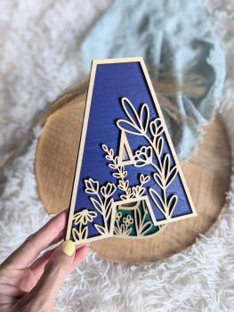 Enhance your nursery or child&rsquo;s room with a personalized safari-themed name sign. Crafted from 6mm basswood and hand-painted for a stunning 3D effect, this custom wall art adds charm and warmth to any space. Choose from various colours or keep it natural for a timeless look.
