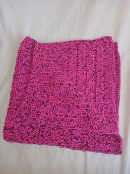 Baby blanket deep pink with black fleck.