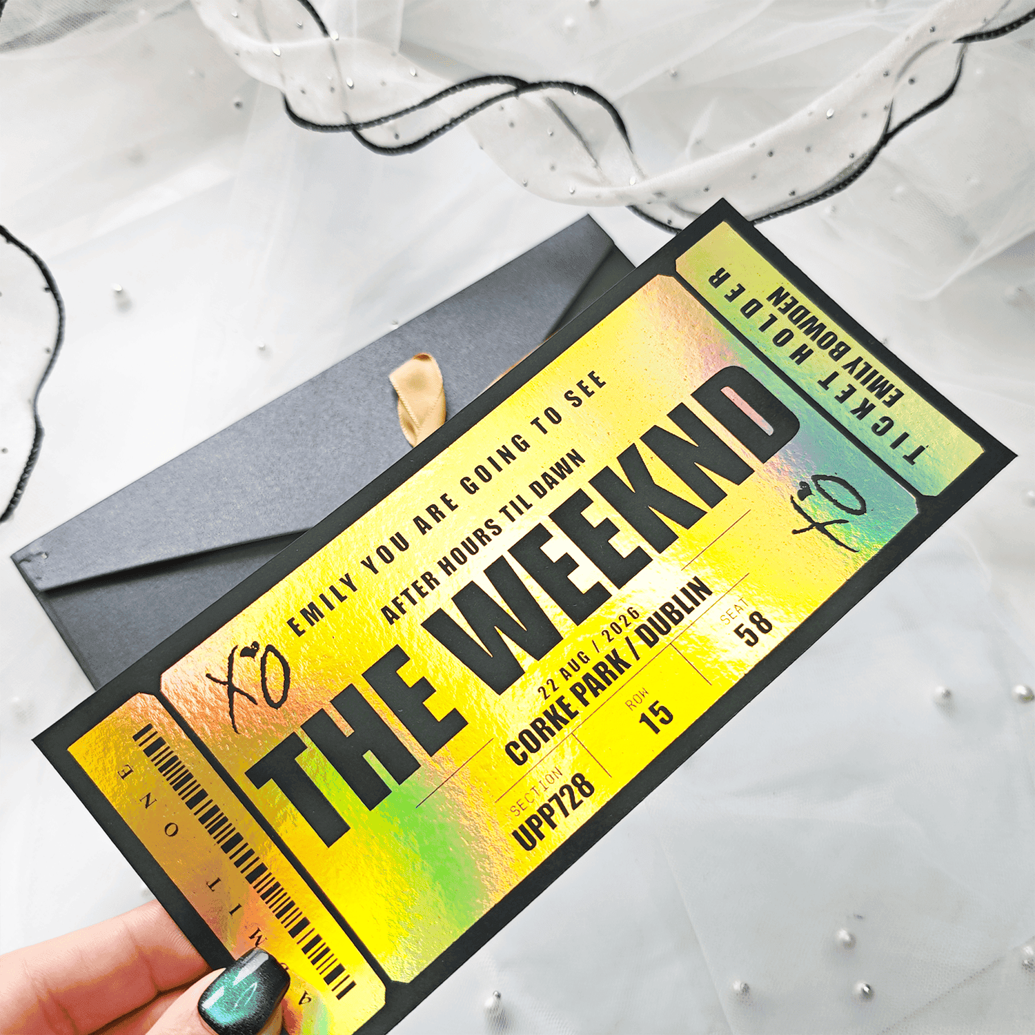 Personalised Foil Ticket Features &amp; Handmade Details
Relive the excitement of&nbsp;The Weeknd&rsquo;s After Hours Til Dawn Tour&nbsp;in Dublin with a personalised foil keepsake ticket. Handmade in County Cork, Ireland by Printarelle, these tickets are designed as lasting mementos for fans who want to capture the magic of this unforgettable night at Croke Park.
How to Order


Enter the name, event details, date, and personal message.


You can choose your preferred foil color and envelope option.


Please double-check all information before placing your order to make sure it's correct.



Important Notes


All details must be correct at the time of ordering. We'd like to carefully review everything before submitting to avoid delays or printing errors.


This is a keepsake gift and does not grant entry to any real event.


Each ticket is securely shipped in a rigid, hard-backed envelope to ensure it arrives in perfect condition.


If you have any special requests or require fully custom designs, please don't hesitate to contact us.


&nbsp;
Give a truly one-of-a-kind gift with a personalized foil ticket &ndash; a stylish and thoughtful way to celebrate any occasion!