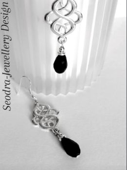 Handmade earrings, created with silver plated celtic knots, silver plated beads and crystal glass drops in black. They are suspended from silver plated, nickel free ear wires, suitable for sensitive ears. Lightweight, comfortable to wear and very versatile.. Elevate your style with these gorgeous bespoke pieces.. They arrive in a pretty organza bag, and have free shipping.