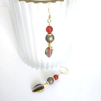 Autumnal earrings, created with beautiful leaf drops in czech glass, marbled glass beads, and natural red agates, they also have gold plated beads and ear wires. The ear wires are nickel free and suitable for sensitive ears. These earrings are light and easy to wear and perfect for Autumn! Showcase your individuality with these bespoke beauties! They arrive in a pretty organza bag, and, have free shipping!