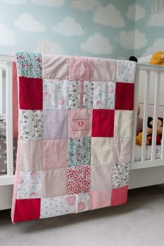 Introducing our custom and unique Keepsake Patchwork Blankets, crafted from your baby's outgrown clothes and available in three sizes: Small, Medium, or Large.