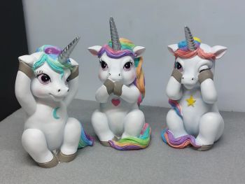 Three Wise White Cutiecorns Figures 9.5cm - See No Evil, Speak No Evil, Hear No Evil - Cute Unicorn with a Star, Heart &amp; Moon on their chest
Set of 3 adorable Unicorns that will brighten up your home.&nbsp;
Illustrating Confucius' famous maxim of &ldquo;See no evil, speak no evil, hear no evil&rdquo;, the cutiecorns sit back on their hind legs.&nbsp;
The first unicorn has a yellow star on the chest, holding his hooves up to his eyes, sneaking a peek around them through long.&nbsp;
The second one, with a pink heart on the chest, clutches their front hooves to their mouth, blushing.
And the third one, with a blue crescent on the chest, looking at you while covering its ears.&nbsp;
All unicorns are white with rainbow-coloured hair and silver horn.
Made with resin and painted afterwards.
✨ Size: Height 9.5cm
✨Allow for some color difference
