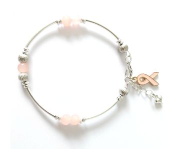 Gorgeous handmade silver plated bracelet, created with light salmon pink translucent glass beads, an enamelled ribbon charm in light salmon pink, and an extension chain, finished with a tiny silver plated heart charm. A lovely bespoke piece, light weight and easy to wear&hellip;. It arrives in a pretty organza bag, and has free shipping.
