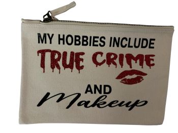 This cotton makeup bag is perfect for anyone obsessed with true crime and glam! Featuring &ldquo;My hobbies include true crime and makeup&rdquo; with glittery red text and lips, it&rsquo;s a stylish and fun pouch for cosmetics or travel
&nbsp;