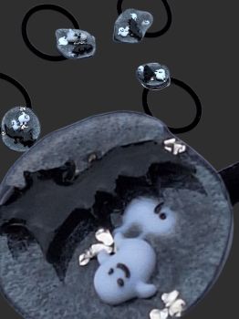 Playful ghost and bat-themed hair tie handmade from resin. Perfect for Halloween!