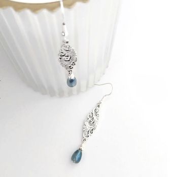 Gorgeous, antique silver filigree earrings, with silver plated beads and beautiful, iridescent glass drops. The ear wires are silver plated and nickel free, suitable for sensitive ears. These earrings are light and easy to wear… Showcase your elegance with these beautiful bespoke pieces…. They arrive in a pretty organza bag, and have free shipping!