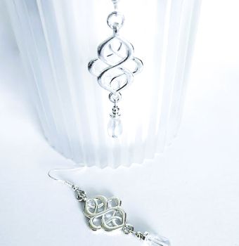 Handmade earrings, created with silver plated celtic knots, silver plated beads and iridescent clear glass drops. They are suspended from silver plated, nickel free ear wires, suitable for sensitive ears. Lightweight, comfortable to wear and very versatile.. Elevate your style with these gorgeous bespoke pieces.. They arrive in a pretty organza bag, and have free shipping.